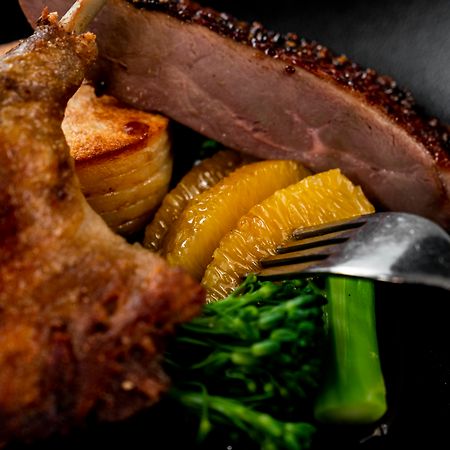 The Point Brisbane Hotel Exteriör bild A duck confit with orange and vegetables