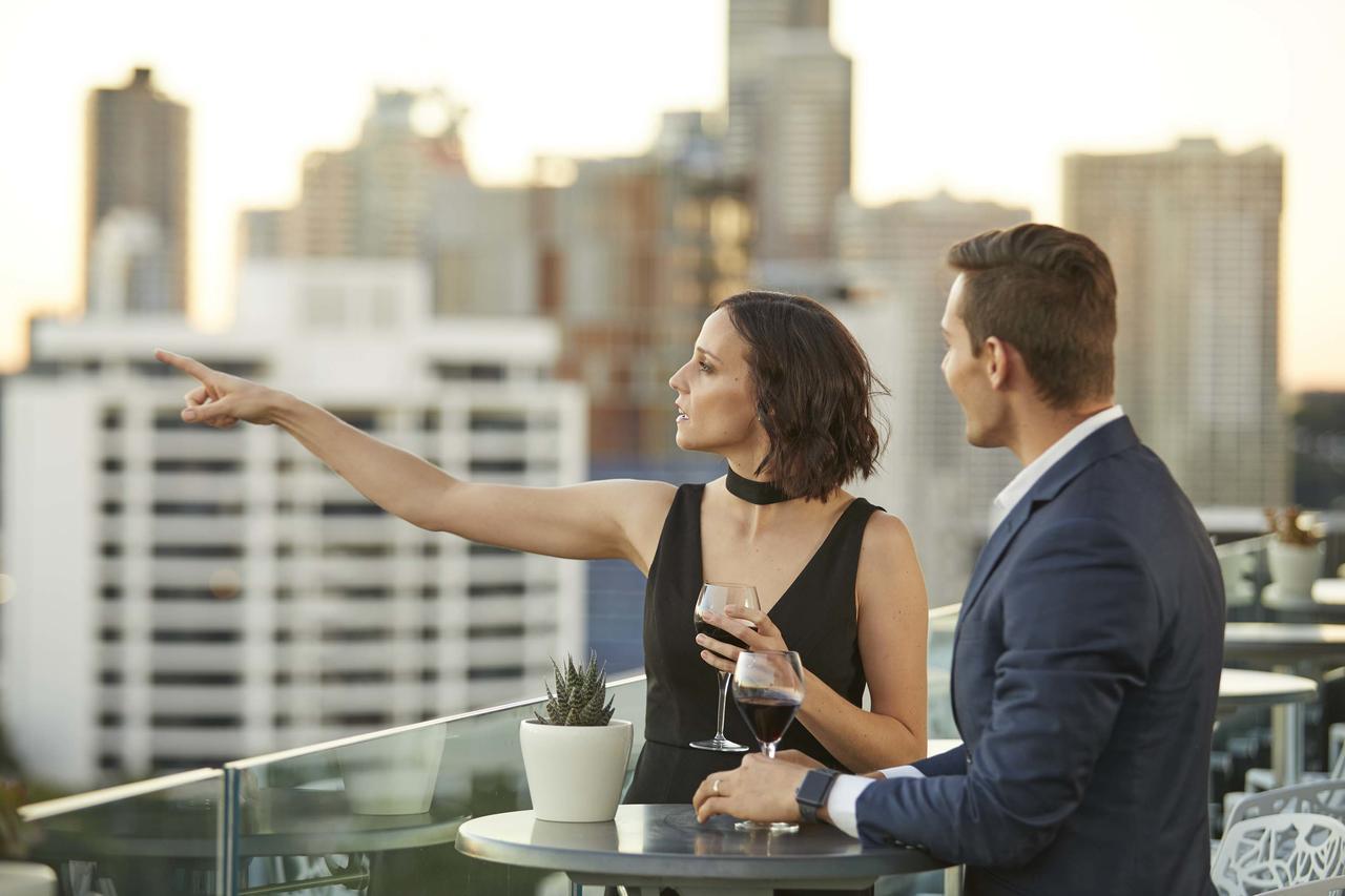 The Point Brisbane Hotel Exteriör bild A couple at a rooftop party